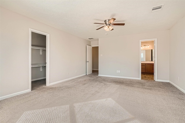 514 Remington Green Ct, Houston, TX 77073 - unfurnished bedroom with visible vents, a spacious closet, carpet floors, and baseboards