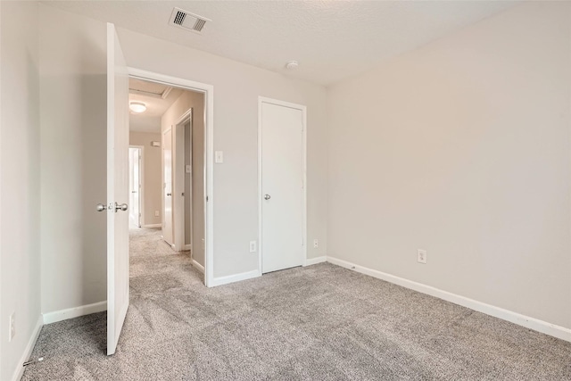 514 Remington Green Ct, Houston, TX 77073 - unfurnished bedroom featuring attic access, visible vents, light colored carpet, and baseboards