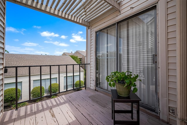 balcony featuring a pergola