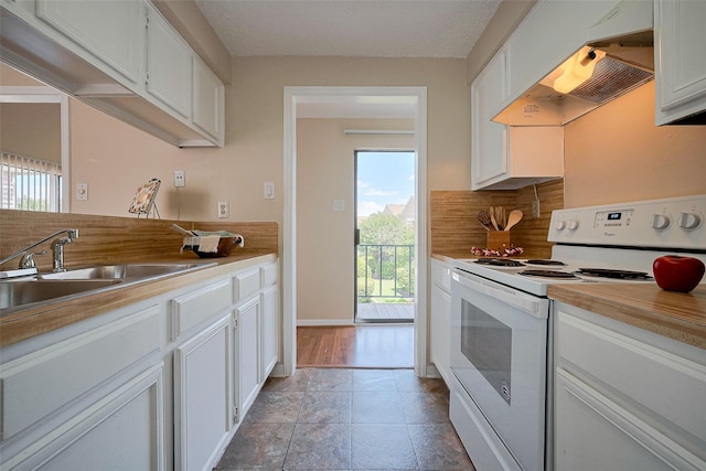 kitchen featuring white cabinetry, backsplash, electric range, and under cabinet range hood