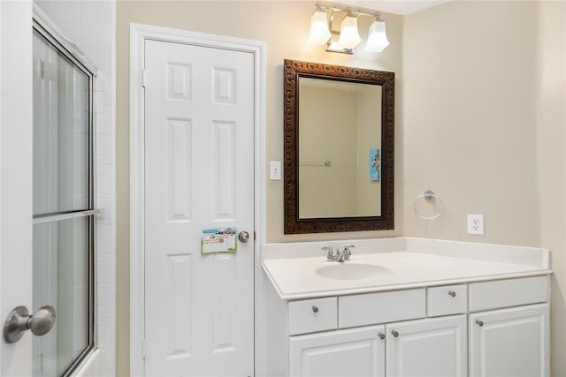 full bathroom featuring shower / bath combination with glass door and vanity