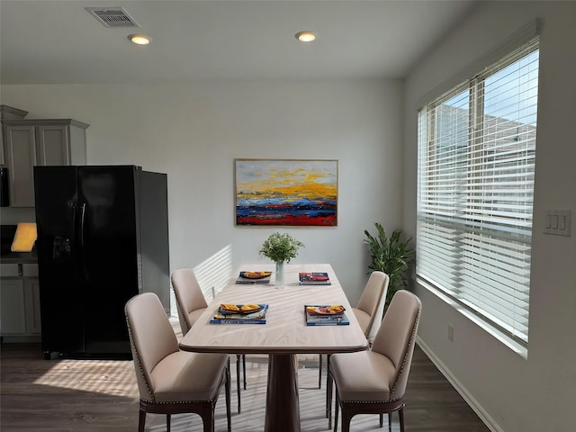 dining space featuring dark wood-type flooring, visible vents, baseboards, and recessed lighting