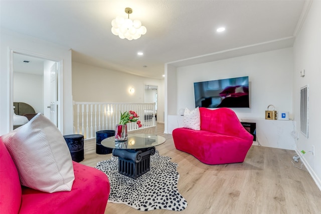 living area featuring wood finished floors, visible vents, and recessed lighting