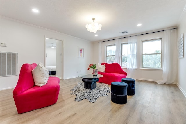 living area featuring crown molding and visible vents
