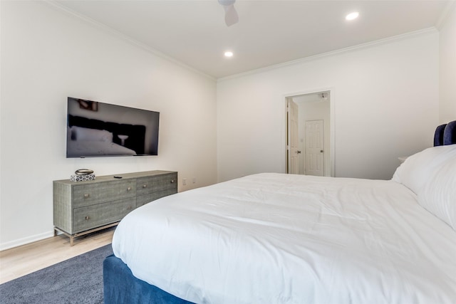 bedroom with crown molding, recessed lighting, and wood finished floors