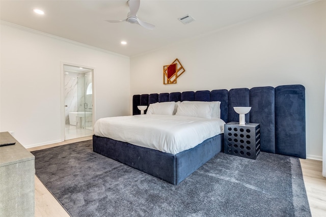 bedroom featuring crown molding, ensuite bathroom, visible vents, recessed lighting, and wood finished floors