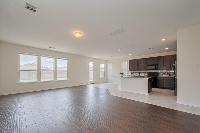 25327 Cheshire Knoll St, Katy, TX 77493 - unfurnished living room featuring recessed lighting, baseboards, and light wood finished floors