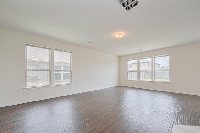 25327 Cheshire Knoll St, Katy, TX 77493 - spare room featuring plenty of natural light, dark wood-style floors, and baseboards