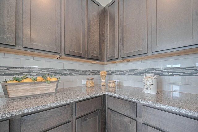 25327 Cheshire Knoll St, Katy, TX 77493 - kitchen with backsplash, gray cabinetry, and light stone counters
