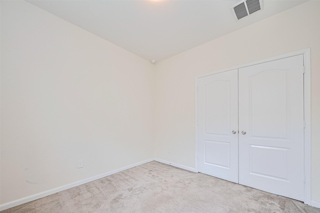 25327 Cheshire Knoll St, Katy, TX 77493 - unfurnished bedroom with light colored carpet, baseboards, and a closet