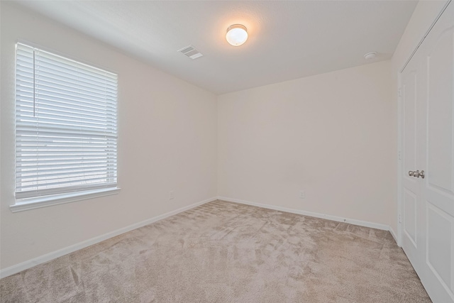 25327 Cheshire Knoll St, Katy, TX 77493 - empty room featuring light carpet and baseboards