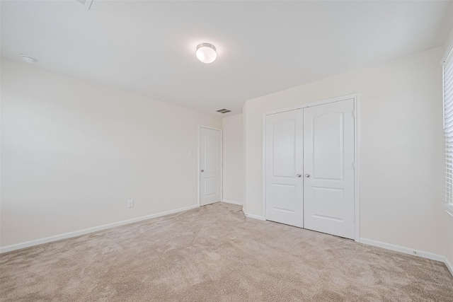 25327 Cheshire Knoll St, Katy, TX 77493 - unfurnished bedroom with light colored carpet, baseboards, and a closet