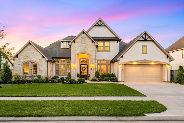 1828 Anna Way, Friendswood, TX 77546 - french country style house featuring stone siding, a front lawn, concrete driveway, stucco siding, and a garage