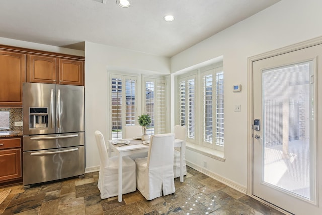 15614 Stone Gables Ln, Houston, TX 77044 - dining space with baseboards, recessed lighting, plenty of natural light, and dark stone finish flooring