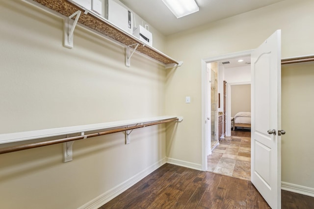 15614 Stone Gables Ln, Houston, TX 77044 - spacious closet with dark wood-style floors