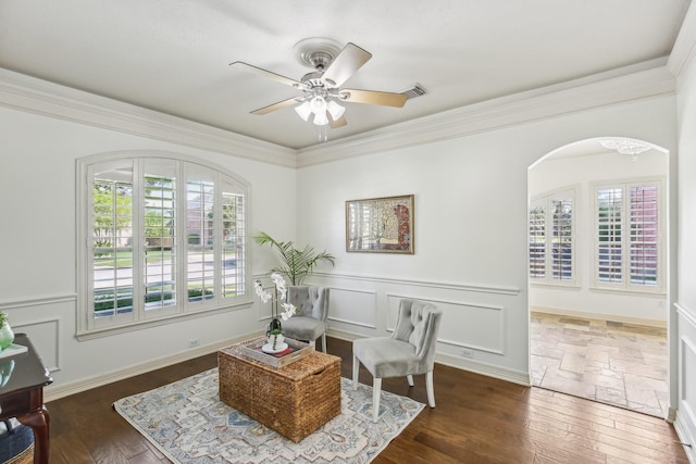 15614 Stone Gables Ln, Houston, TX 77044 - sitting room with ornamental molding, dark wood-style floors, a ceiling fan, and arched walkways