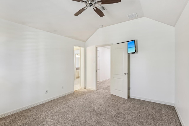 15614 Stone Gables Ln, Houston, TX 77044 - unfurnished bedroom featuring vaulted ceiling, light carpet, ceiling fan, and baseboards