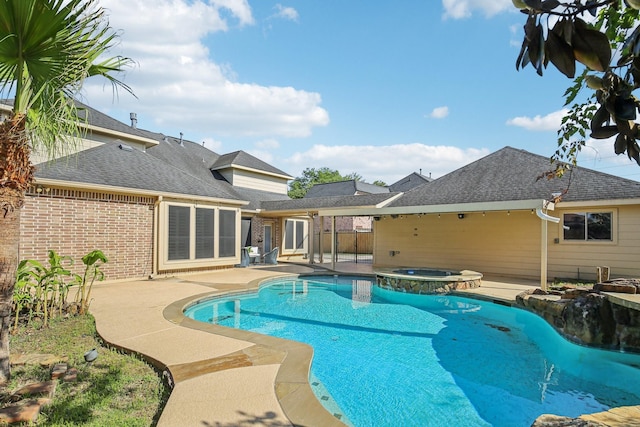 15614 Stone Gables Ln, Houston, TX 77044 - view of swimming pool with a patio area and a pool with connected hot tub