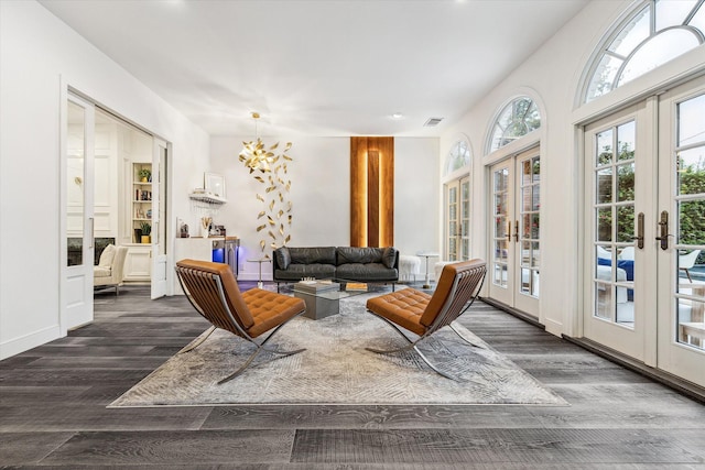 2114 Wroxton Rd, Houston, TX 77005 - living area with visible vents, baseboards, an inviting chandelier, wood finished floors, and french doors