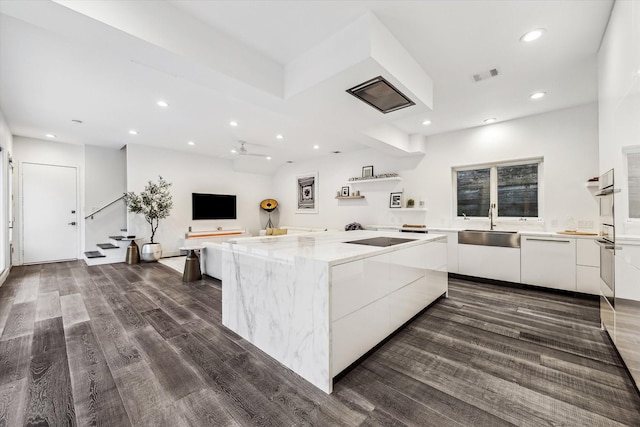 2114 Wroxton Rd, Houston, TX 77005 - kitchen with visible vents, white cabinets, dark wood finished floors, and modern cabinets