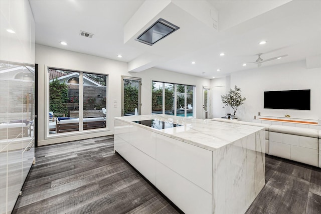 2114 Wroxton Rd, Houston, TX 77005 - kitchen with visible vents, dark wood finished floors, white cabinetry, and modern cabinets