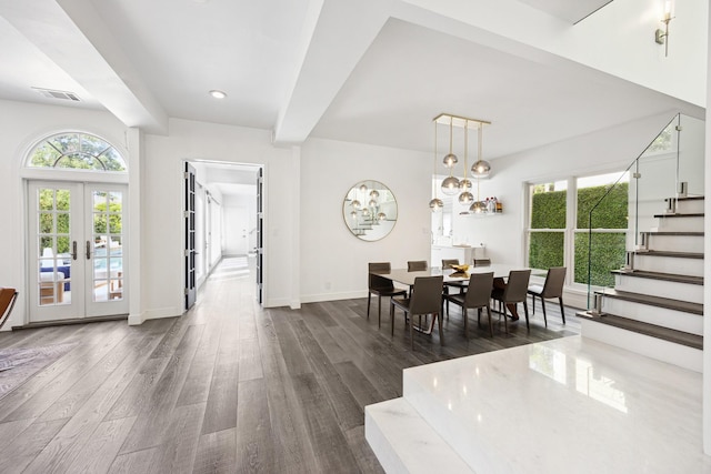 2114 Wroxton Rd, Houston, TX 77005 - dining space featuring french doors, dark wood-style flooring, baseboards, and stairway