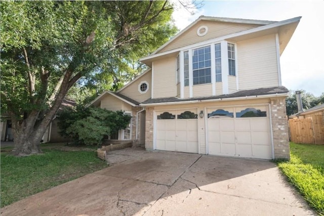 16007 Sierra Vista Dr, Houston, TX 77083 - traditional home featuring a garage, brick siding, driveway, and fence