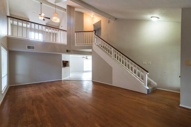 16007 Sierra Vista Dr, Houston, TX 77083 - unfurnished living room with visible vents, baseboards, ceiling fan, stairway, and wood finished floors