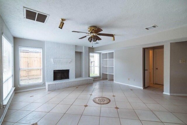 16007 Sierra Vista Dr, Houston, TX 77083 - unfurnished living room with a ceiling fan, visible vents, and plenty of natural light