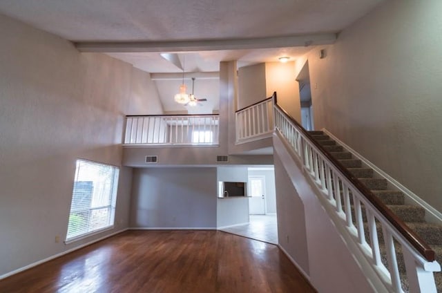 16007 Sierra Vista Dr, Houston, TX 77083 - stairway featuring beam ceiling, baseboards, an inviting chandelier, and wood finished floors