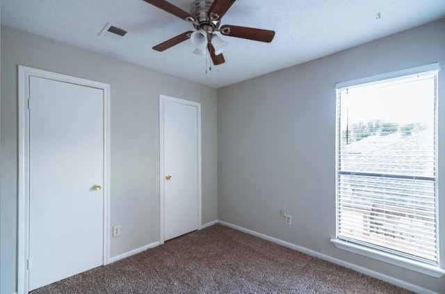 16007 Sierra Vista Dr, Houston, TX 77083 - unfurnished bedroom featuring ceiling fan, visible vents, baseboards, and carpet floors