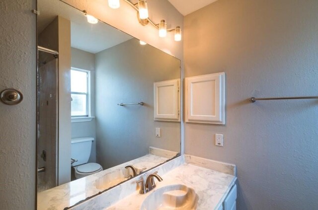 16007 Sierra Vista Dr, Houston, TX 77083 - bathroom featuring toilet, vanity, and walk in shower