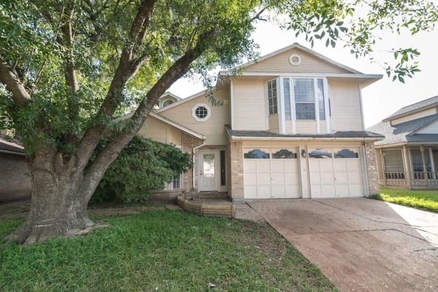 16007 Sierra Vista Dr, Houston, TX 77083 - traditional-style home with concrete driveway, a front lawn, and an attached garage
