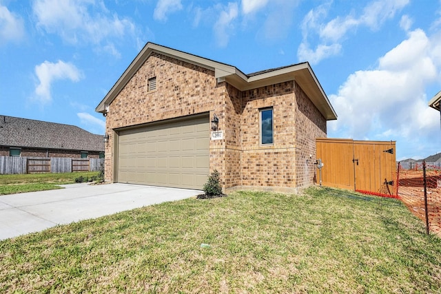 ranch-style home featuring brick siding, fence, driveway, and a front yard