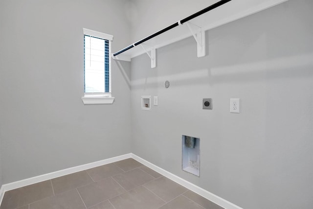 laundry area featuring baseboards, hookup for a washing machine, electric dryer hookup, gas dryer hookup, and laundry area