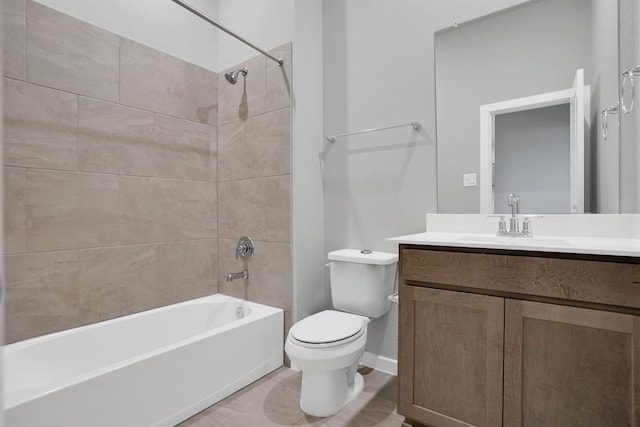 full bathroom with baseboards, washtub / shower combination, vanity, and toilet