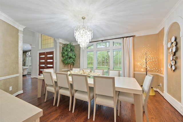 15431 Greens Cove Way, Houston, TX 77059 - dining room with a chandelier, wood finished floors, crown molding, baseboards, and ornate columns
