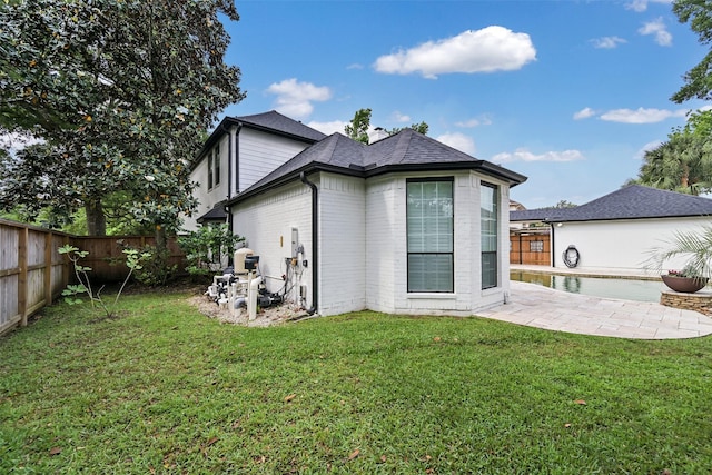 15431 Greens Cove Way, Houston, TX 77059 - back of property with a patio area and brick siding