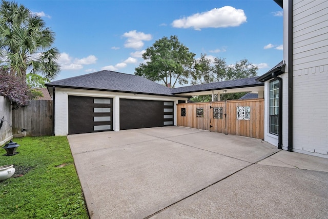 15431 Greens Cove Way, Houston, TX 77059 - garage with fence and concrete driveway