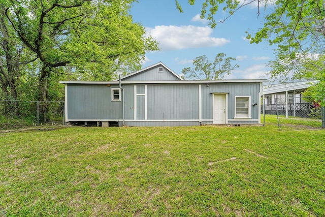 5910 Edward Dr, Houston, TX 77396 - rear view of house featuring fence and a lawn