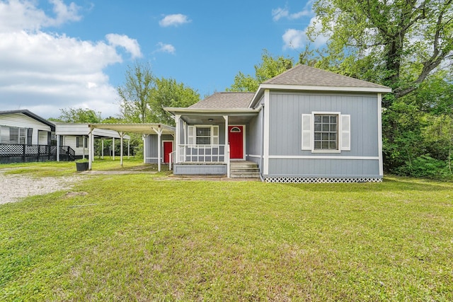 5910 Edward Dr, Houston, TX 77396 - view of front of home with a front yard, roof with shingles, and a detached carport