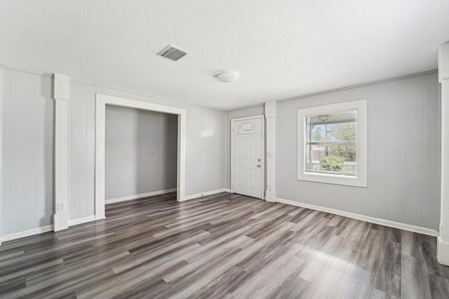 5910 Edward Dr, Houston, TX 77396 - interior space featuring a textured ceiling, wood finished floors, baseboards, and visible vents