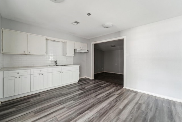 5910 Edward Dr, Houston, TX 77396 - kitchen with dark wood finished floors, light countertops, a sink, baseboards, and backsplash