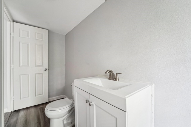 5910 Edward Dr, Houston, TX 77396 - bathroom with toilet, vanity, and wood finished floors