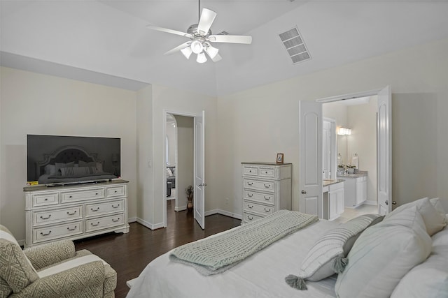 bedroom featuring connected bathroom, a ceiling fan, visible vents, wood finished floors, and baseboards