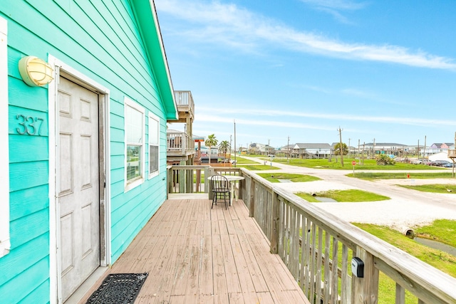 wooden terrace with a residential view