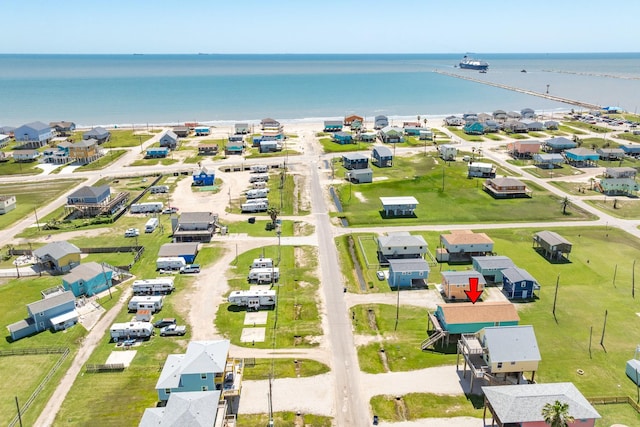 drone / aerial view featuring a residential view and a water view