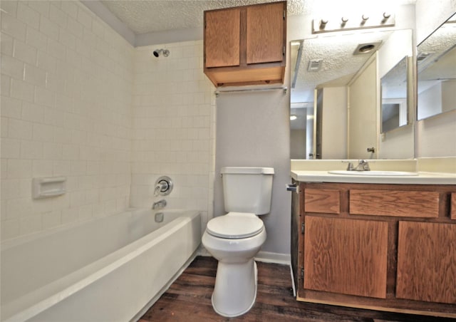 7111 Brendam Ln, Houston, TX 77072 - full bathroom with bathtub / shower combination, a textured ceiling, vanity, toilet, and wood finished floors