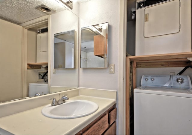 7111 Brendam Ln, Houston, TX 77072 - bathroom with stacked washing maching and dryer, vanity, and toilet