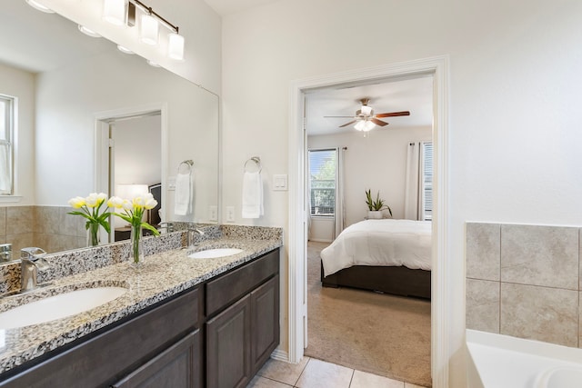 12420 Southern Trail Ct, Magnolia, TX 77354 - bathroom featuring tile patterned floors, ensuite bathroom, a sink, and a ceiling fan